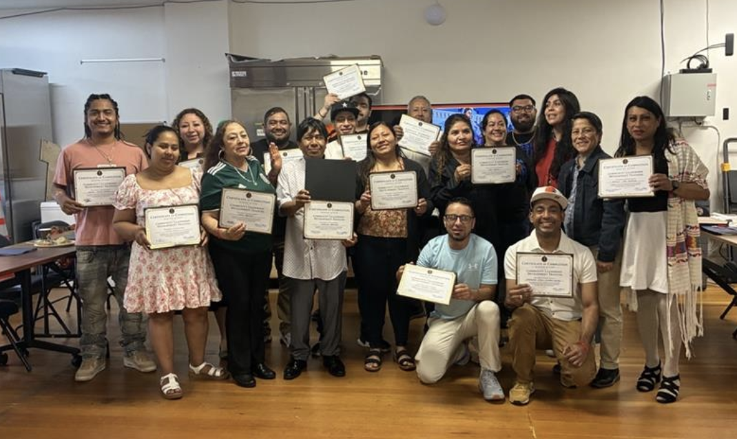 Community Leadership Training - photo of a group of people holding certificates